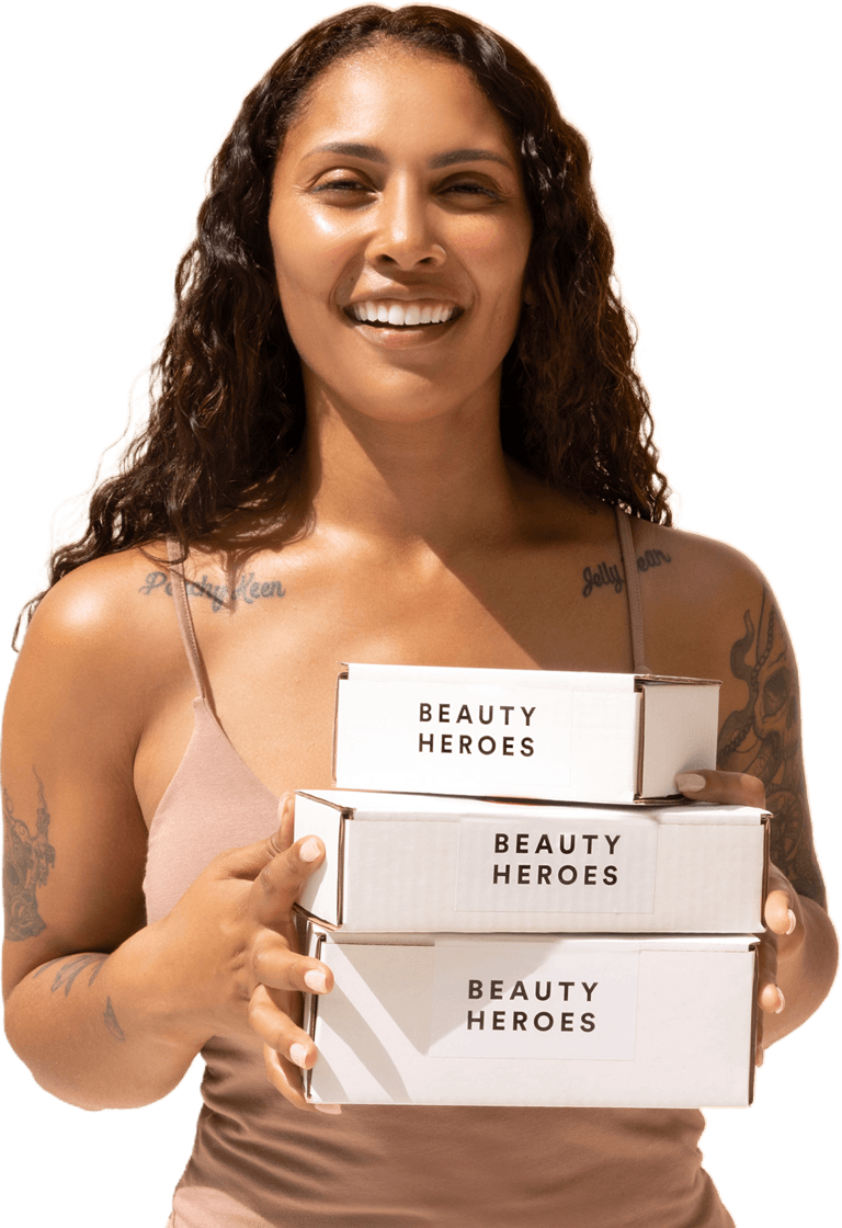 Woman holding three Beauty Heroes Boxes
